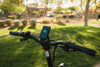 Electric bicycle rider travelling on a paved road